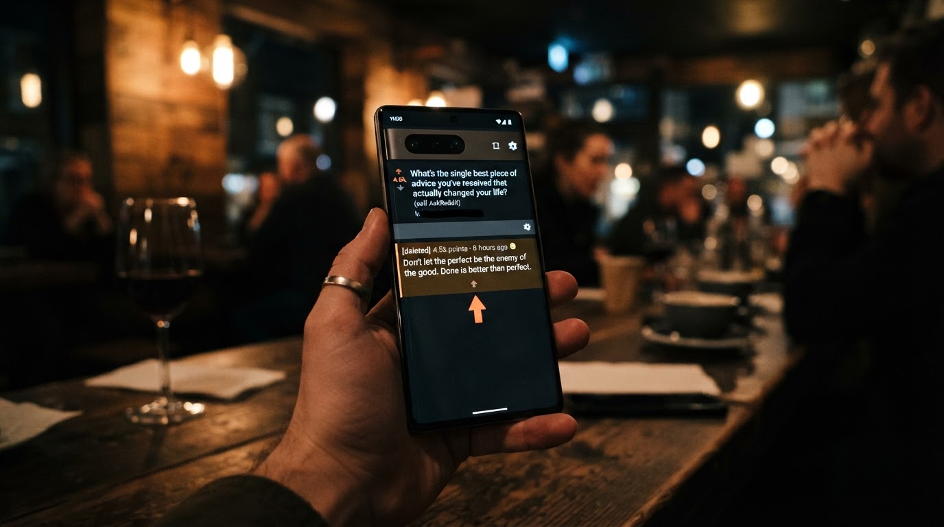 Close-up of a smartphone showing a Reddit thread with the top comment highlighted and an upward arro